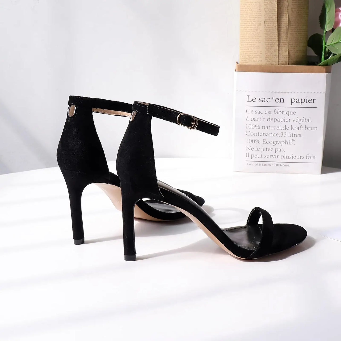 Women's black high heels, strappy design, stiletto rope accents. Ankle strap, size 7.5
